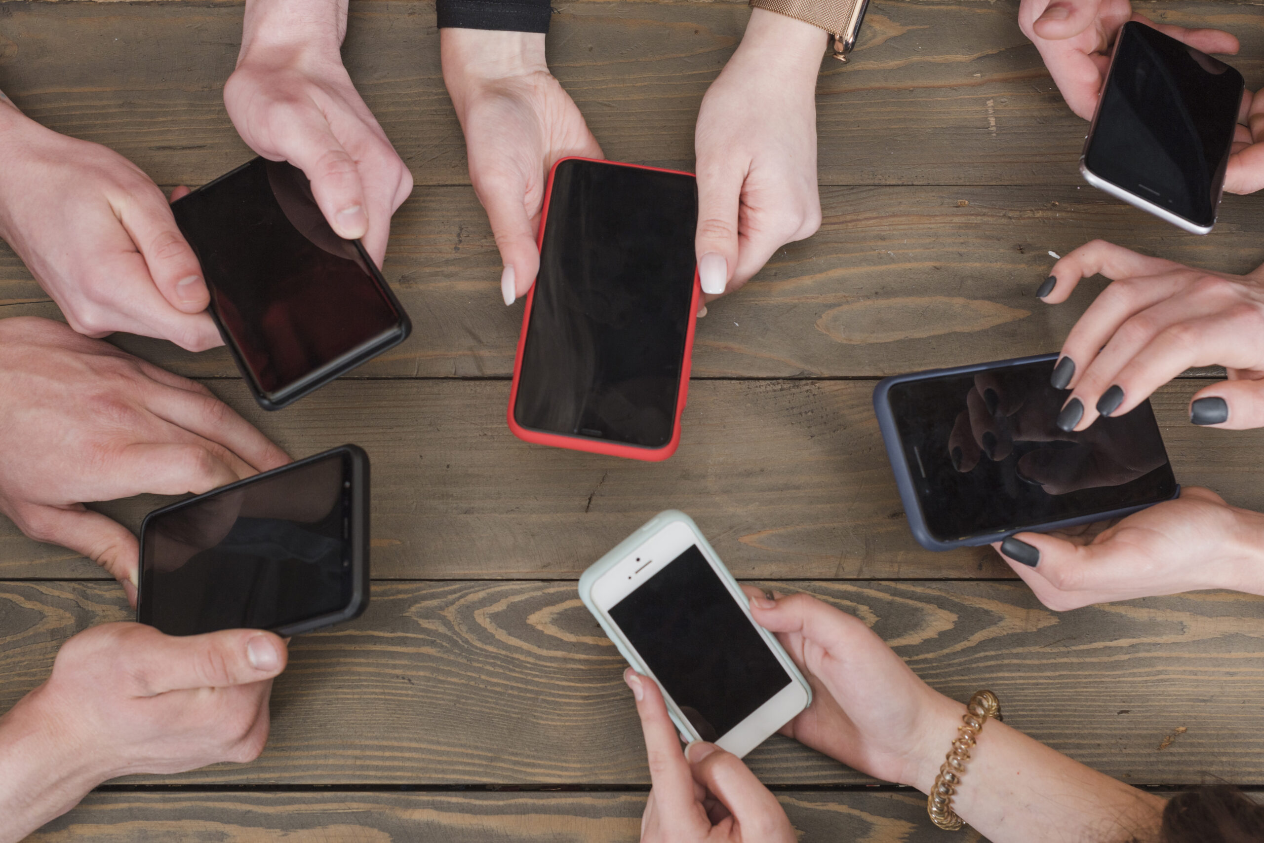 group-friends-using-smartphones